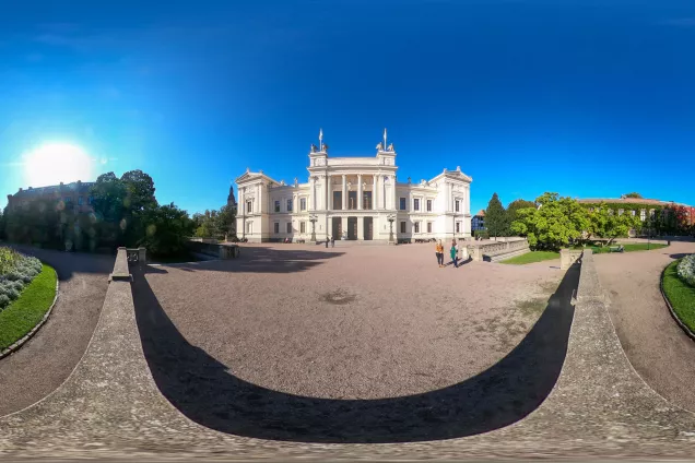 A 360 image of the Main University Building against a blue sky in early autumn